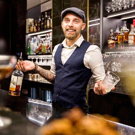 Movenpick Hotel Auckland Exterior photo A bartender at work