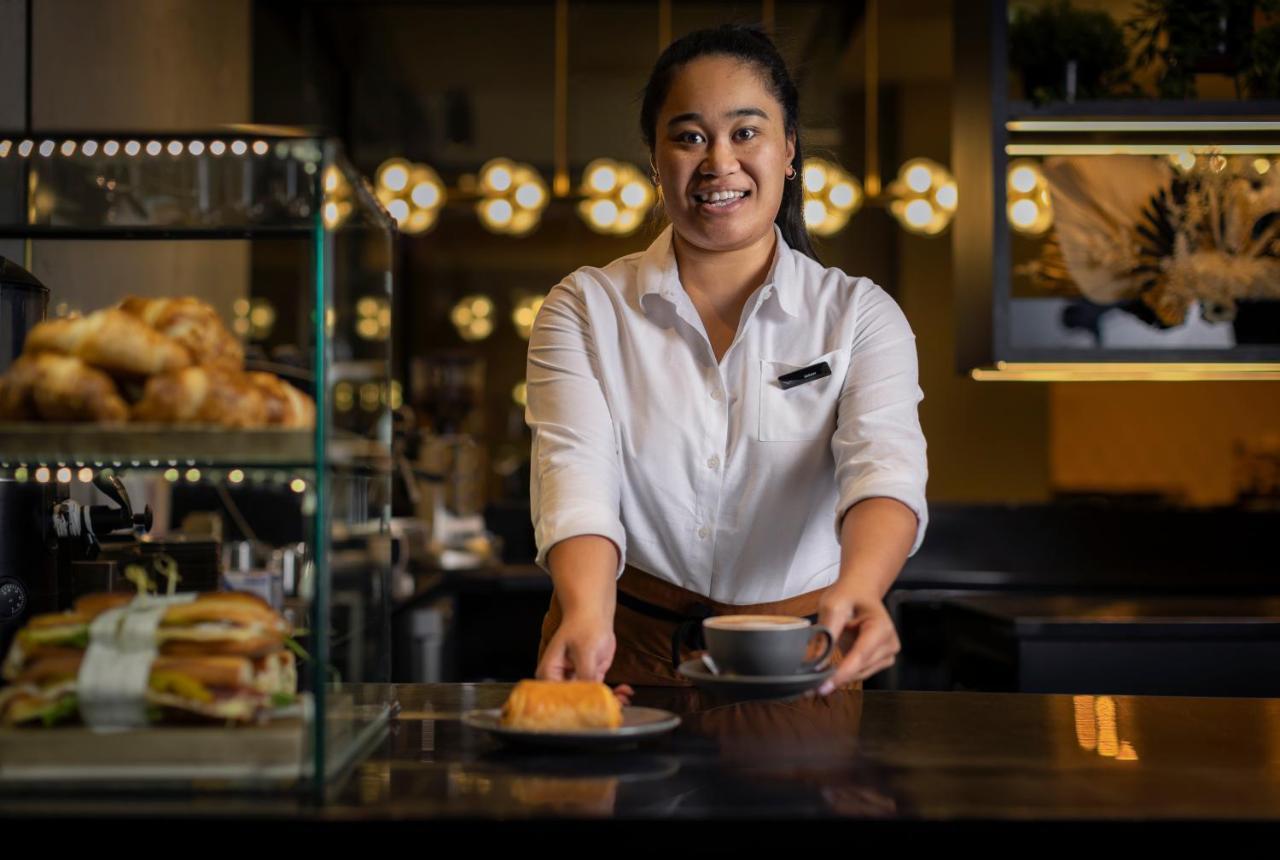 Movenpick Hotel Auckland Exterior photo A barista serving coffee