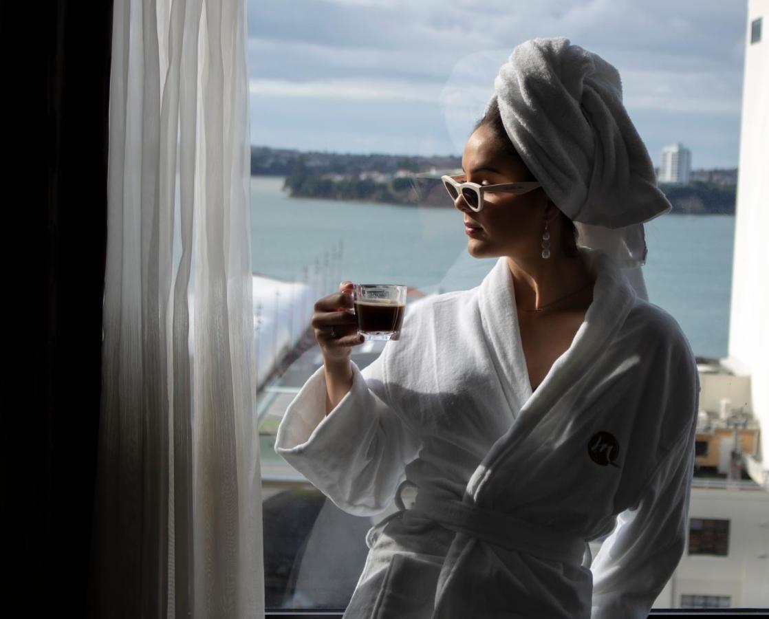 Movenpick Hotel Auckland Exterior photo A woman wearing a bathrobe